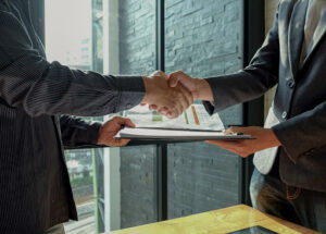 A CPA meeting with a trustee to put together a trust accounting.