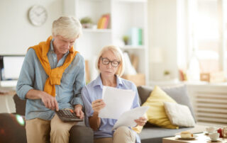 A couple avoiding common tax mistakes after learning all the changing requirements of tax filing for seniors.