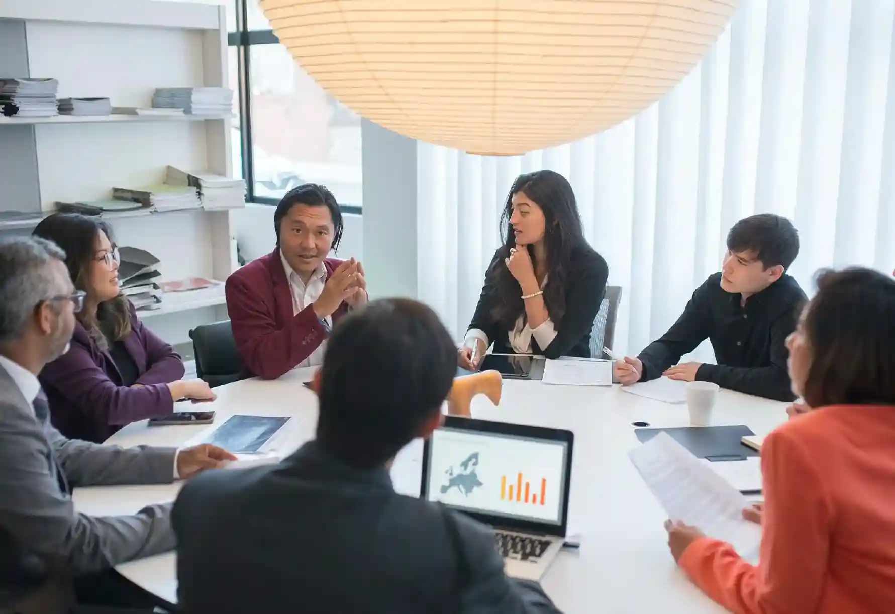 Confident CFO analyzing financial reports and demonstrating exceptional leadership skills.