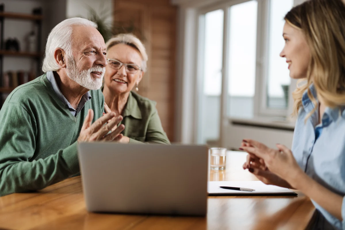 fiduciary advisor in California explaining to senior couple what is a fiduciary and how it can help them