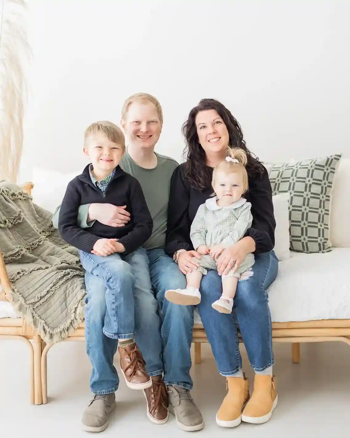 The Cole-Monroe family posing together outdoors, smiling and enjoying quality family time.