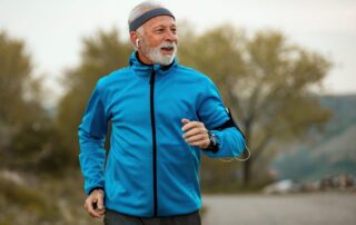 A happy senior on a jog after their child learned how to talk to siblings about an aging parent’s care.