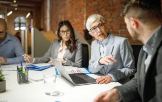 Team reviewing charts during a strategy session—strategic planning for nonprofits.