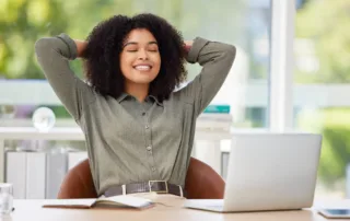 A trustee leaning back, relieved after learning how to do trust accounting in California and seeking help with this burden.