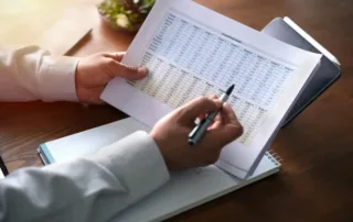 Small business owner working with a CPA on financial statements.