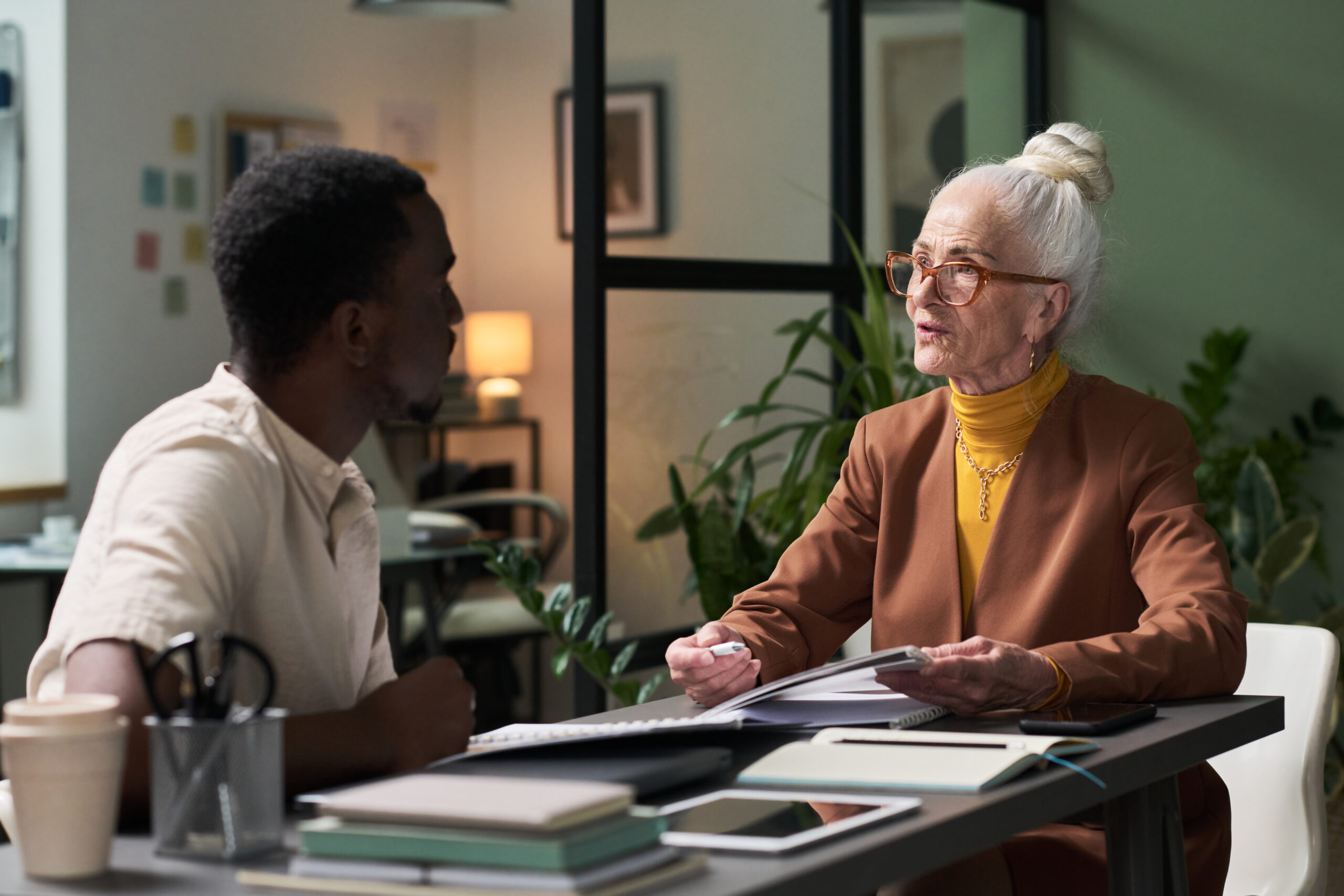 Senior Businesswoman Reviewing Documents with Colleague Reasons to get power of attorney for a parent with alzheimers