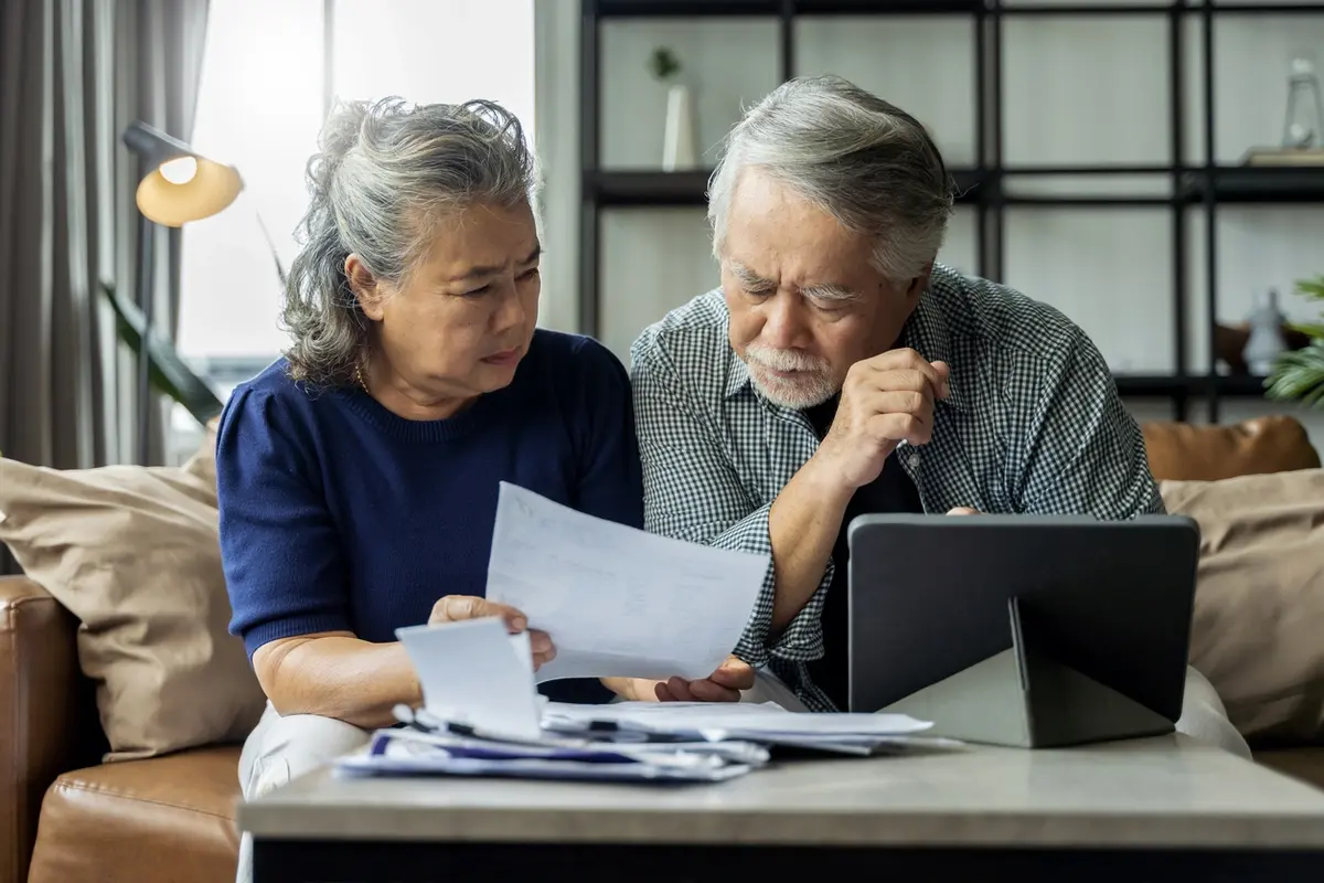 A senior couple struggling with their finances who need trustee services in california