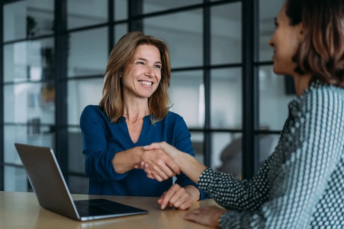 What is the Purpose of a California Trust Accounting A trustee shaking hands with an expert in California trust accounting, smiling because he will some help.