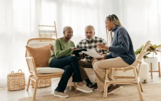 Person reviewing finances on a laptop, learning What Are the Three Duties of a Fiduciary for better decisions