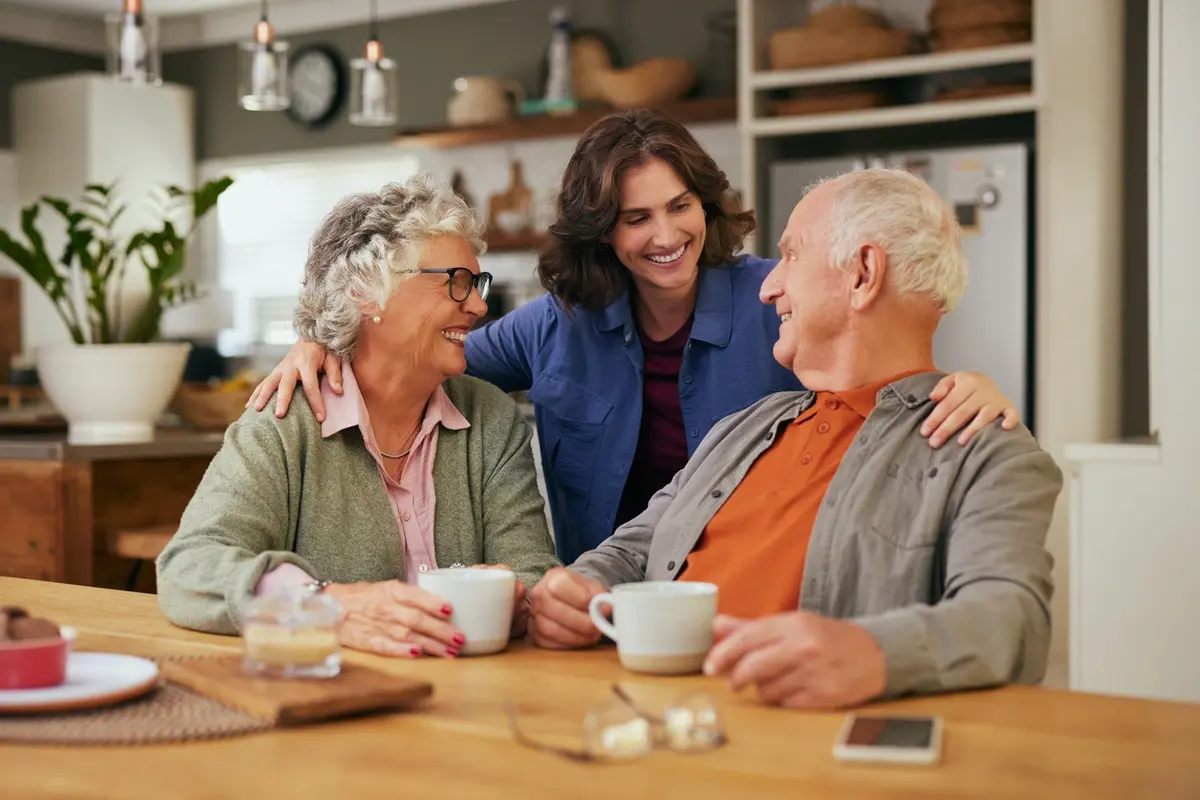 Adult daughter with older parents, showing ways to help your parents with their finances
