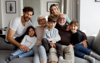 Multigenerational family smiling together, reflecting eldercare support and planning in Riverside