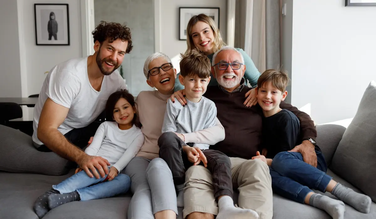 Multigenerational family smiling together, reflecting eldercare support and planning in Riverside