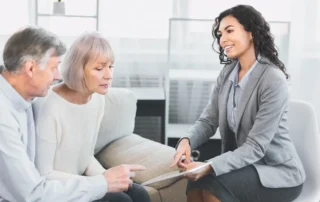 Advisor explains Distribution vs. Disbursement to senior couple during home estate planning meeting