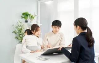 Young parents meet advisor with child to discuss how long trust inheritance may take to receive now.