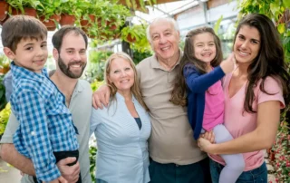 Family smiles together outdoors, illustrating when and why families create conservatorships