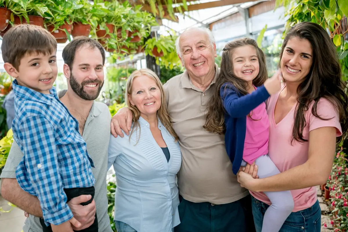 Family smiles together outdoors, illustrating when and why families create conservatorships