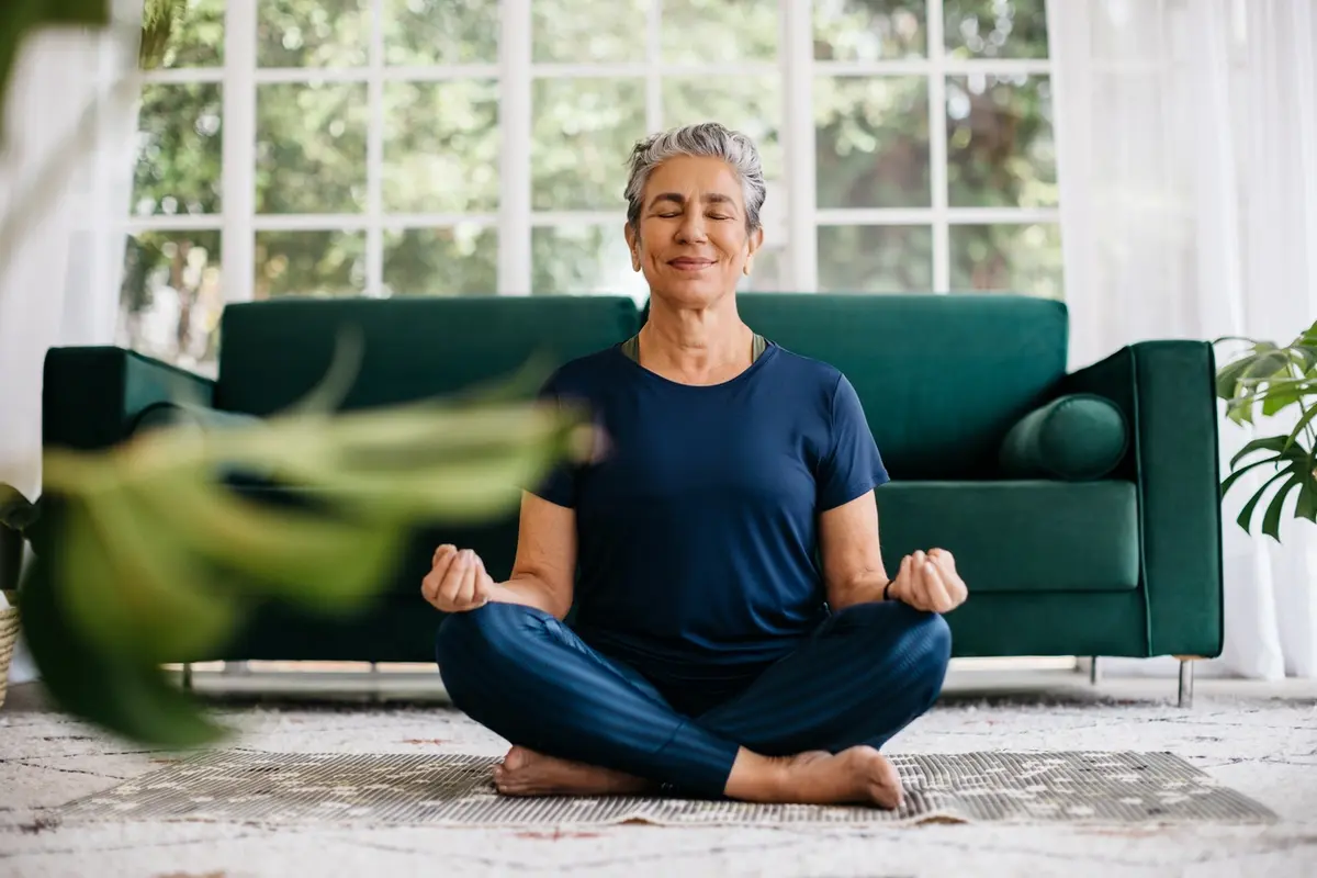 6 Tips For Seniors to Stay Busy While in Isolation,senior doing yoga.