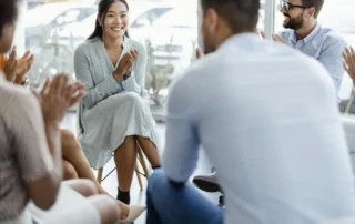A professional raises his arms in a moment of achievement, reflecting the financial security and peace of mind on how a trust can protect assets for vulnerable loved ones.